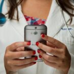 doctor holding phone in hands