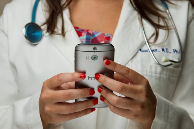 doctor holding phone in hands